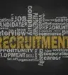 Picture of chalk board with the word Recruitment most visible.